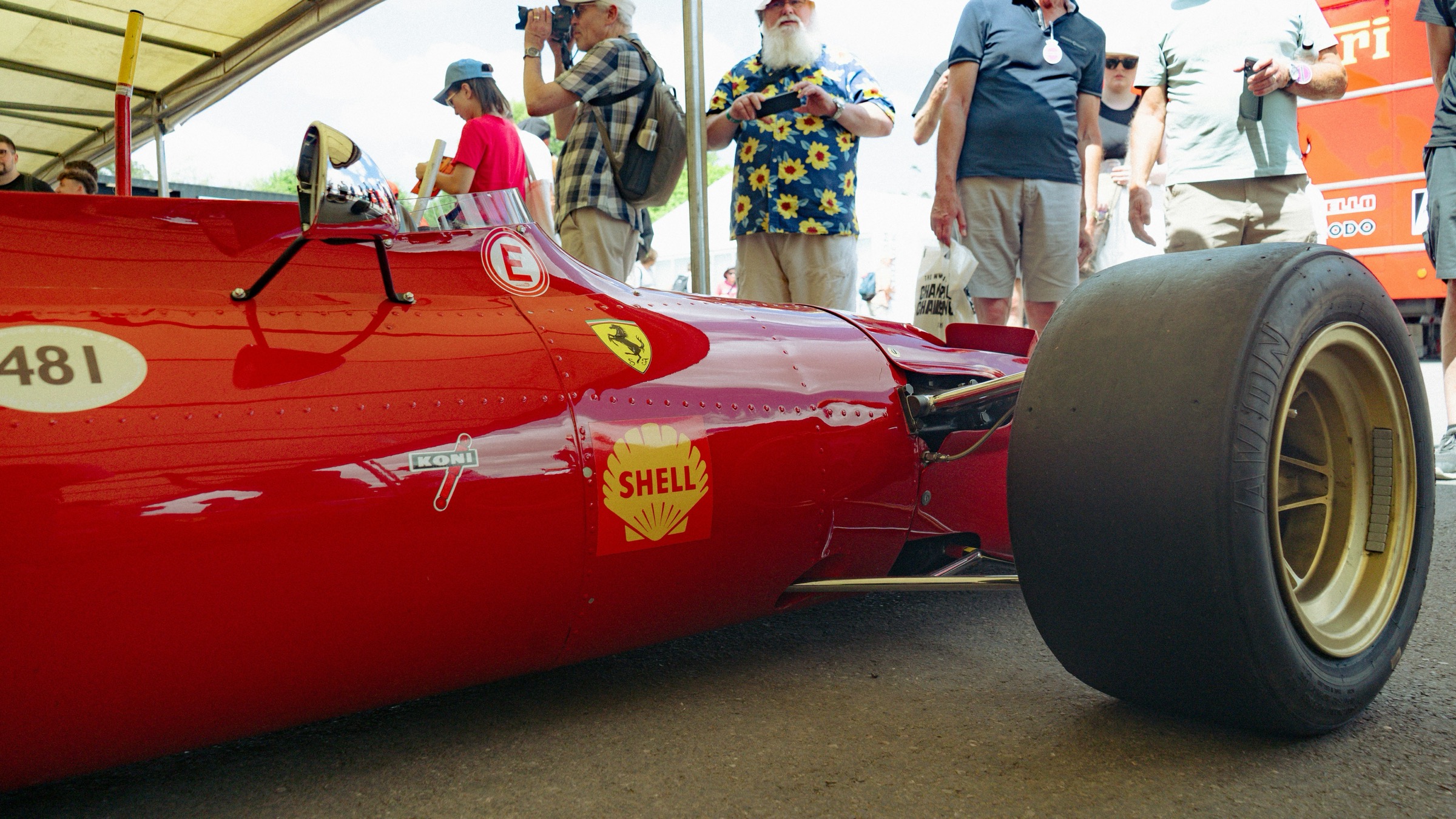 Vintage Ferrari race car #481 in the paddock with spectators — the F1 Experiences Gala vibe Friday of GP weekend