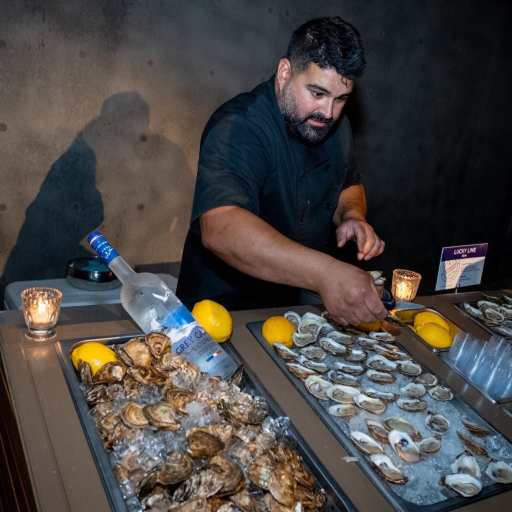 Private oyster shucker serving Malpeque oysters at a Montreal bachelor party residence