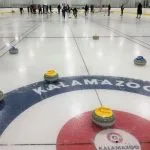 Group of People Playing Curling in Montreal for a Bachelor Party