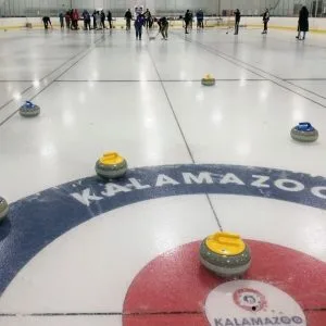 Group of People Playing Curling in Montreal for a Bachelor Party
